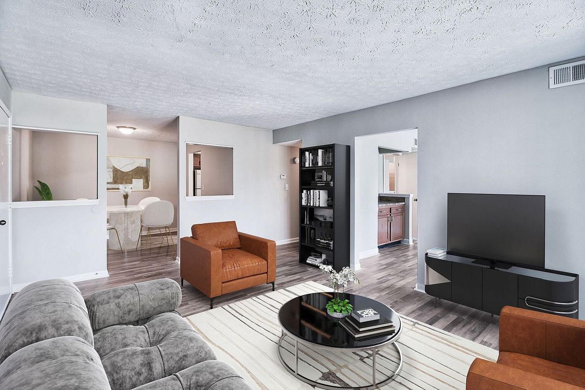 Spacious living room with hardwood-style flooring.