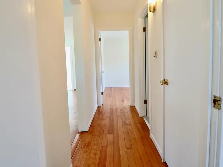 Hallway between the bedrooms and bathroom