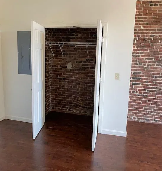 Closet in living room next to entry door. Each bedroom also has a closet.