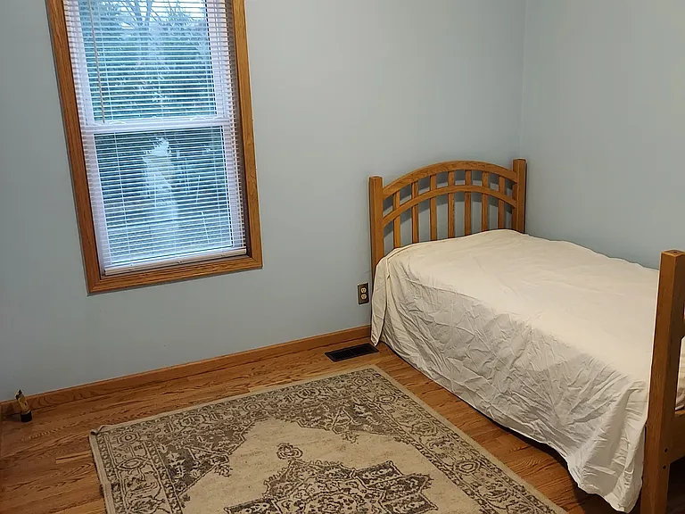1st Bedroom ( blue room ) view from hall .