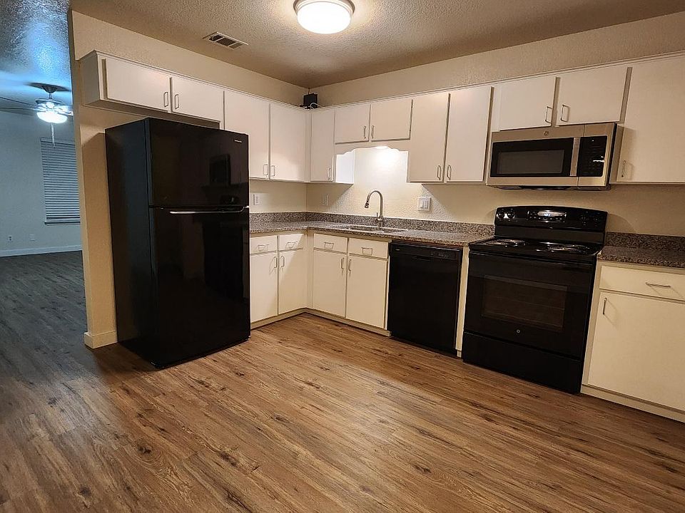 Large kitchen with granite countertops, lots of cabinets with modern doors and pulls, air switch for new disposal and all new appliances.