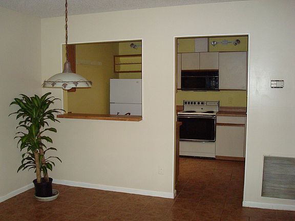 from living room through dining room to kitchen and laundry