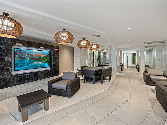 Loggia with cozy seating areas and TV