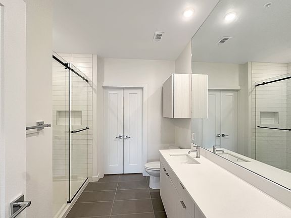 Ensuite with dual vanity and walk-in shower