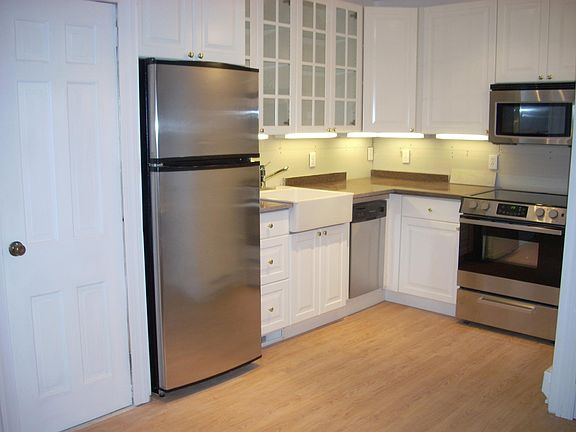 Kitchen. Full size fridge, small dishwasher,microwave