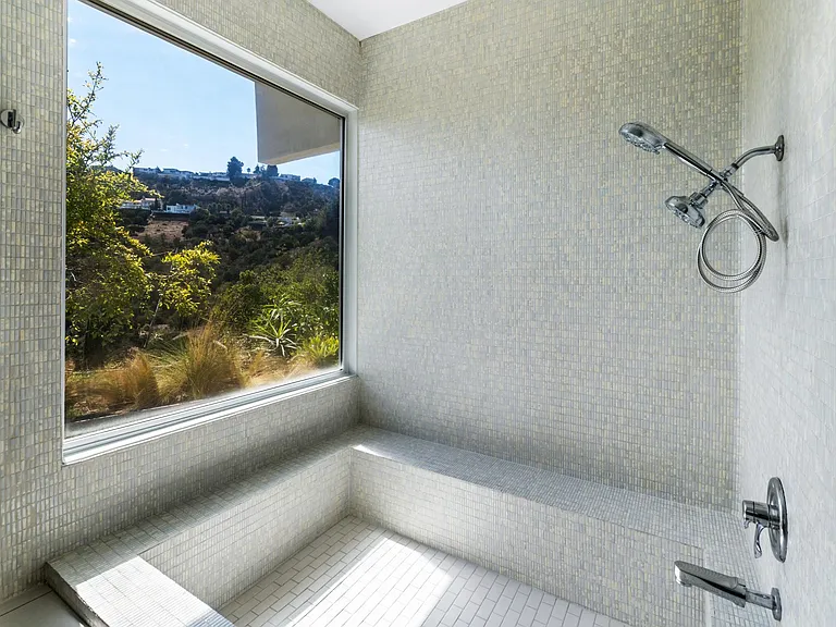 Roman tub with a view! porecelain mosaic tile full enclosure.