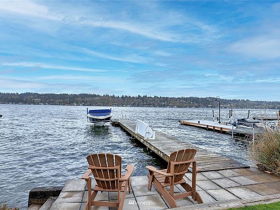 Just steps away, enjoy 30 feet of shared waterfront with a  dock, ideal for boating and summer fun on Lake Washington