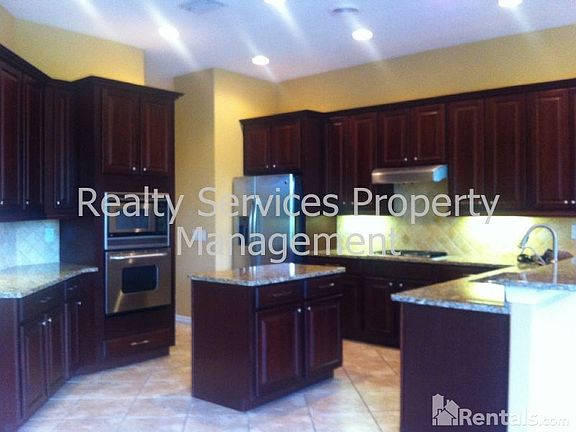 5th image of 5420 Royal Poinciana Way