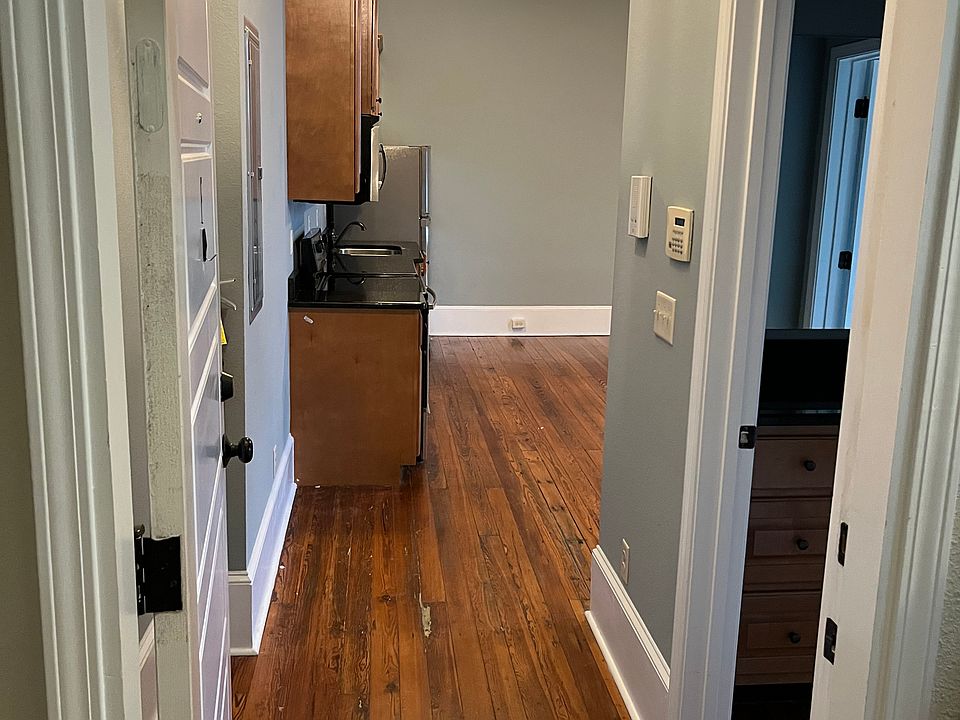 View from front door, bathroom on right and living room straight ahead