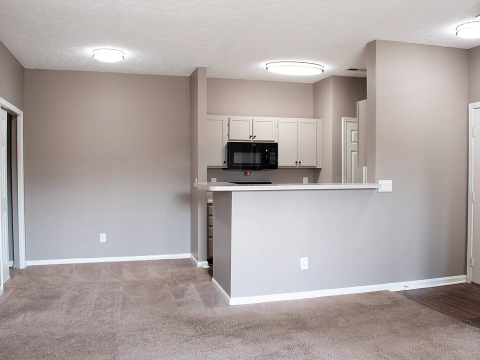 Dining area with overhead-lighting + kitchen breakfast bar