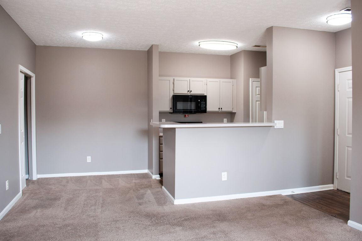 Dining area with overhead-lighting + kitchen breakfast bar