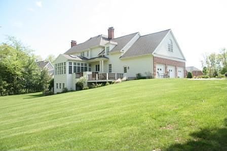 Large open backyard that abuts town land for privacy.
