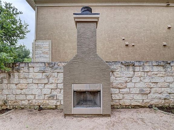 OUTSIDE WOOD BURNING FIREPLACE
