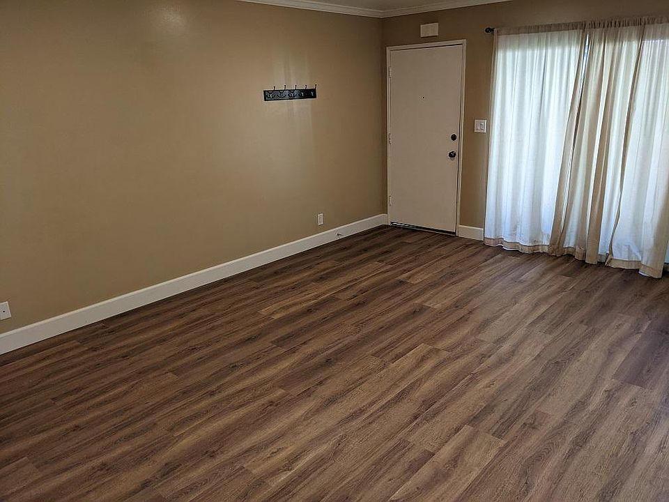 Living room: As viewed from doorway to Master Bedroom, looking towards the front door of Colcadia