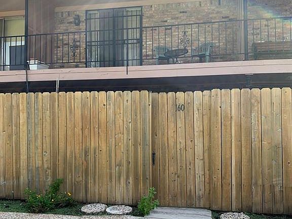 Backyard balcony and patio can be accessed from the courtyard here.