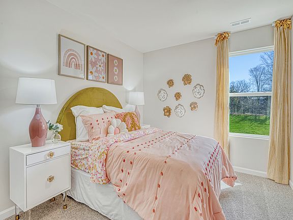 Secondary bedroom in the Amber floorplan at a Meritage Homes community in Graham, NC.