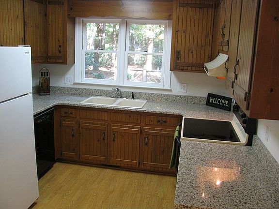 Upgraded kitchen to include granite countertop, dual sink & smooth top range.