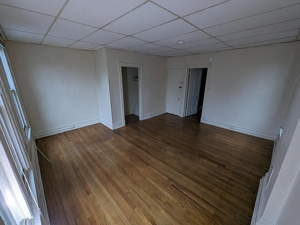 Bedroom is street facing with 4 windows and 1 closet