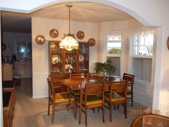 Formal Dining Room just off the kitchen great concept for entertaining your friends and family.