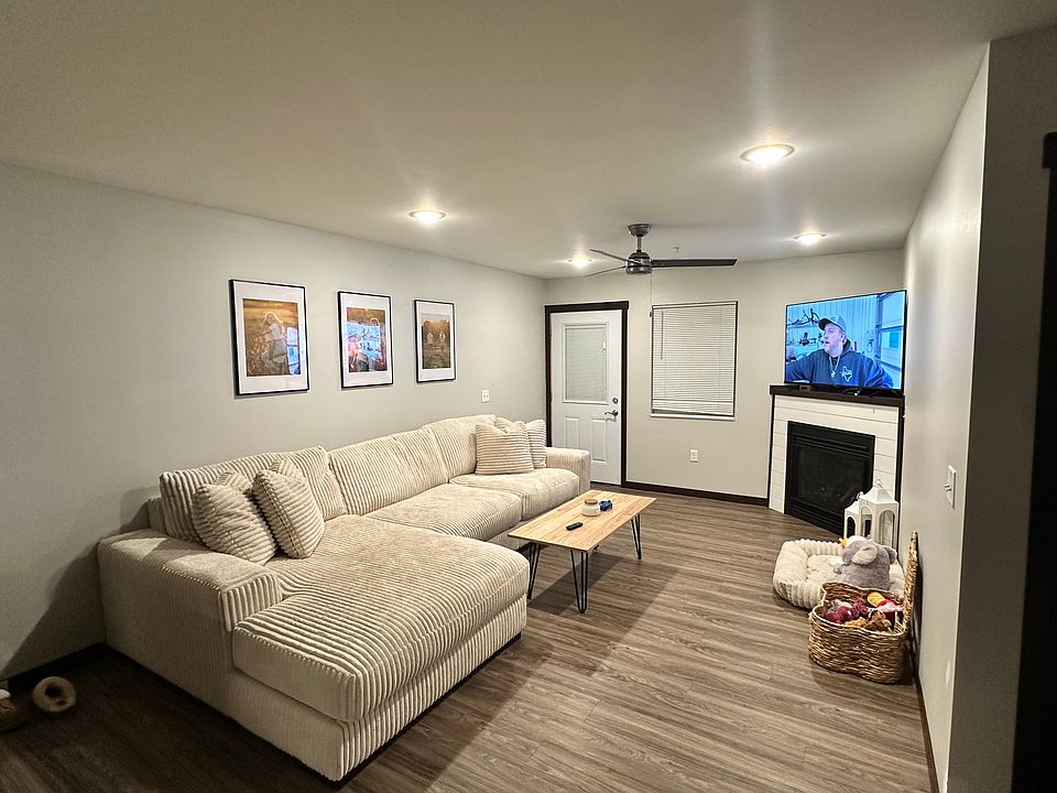 Living room with door going to patio also considered the front door.