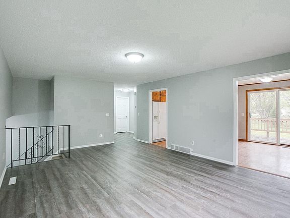 Generous living room with new flooring and paint throughout