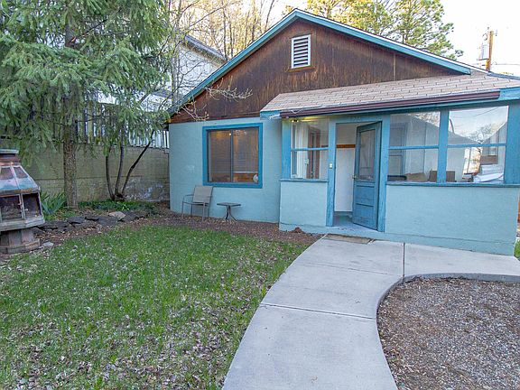 This the front of exterior of home.
the exterior door opens into the sun room which can accommodate a few chairs and small table. 
Also, the sun room it great for a cloak room.