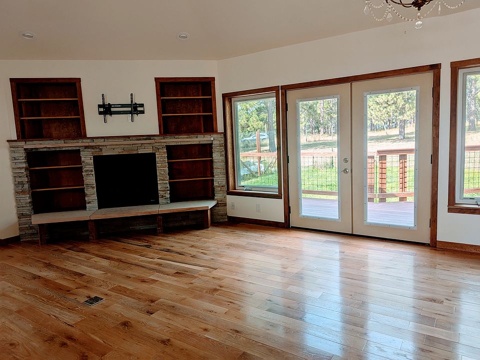Open concept living space with gas fireplace.