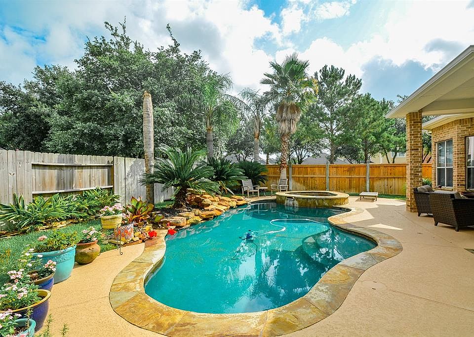 Welcome to your own backyard oasis with sparkling pool and spa!