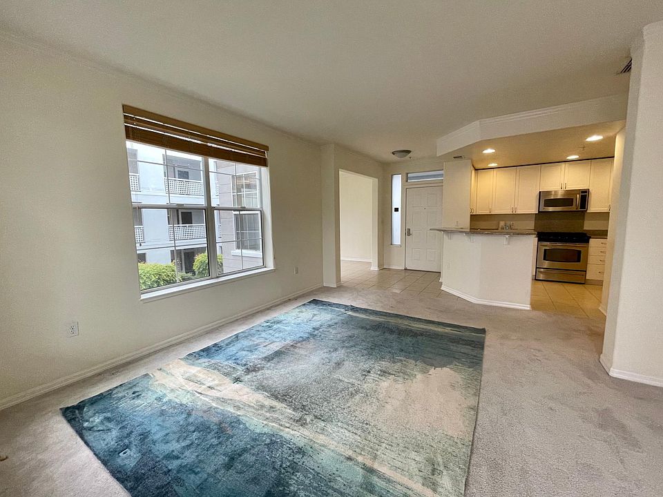 Living room, entrance, and kitchen