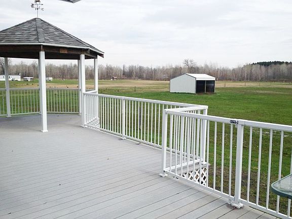 Can you see yourself sitting out here this summer sipping your favorite beverage, and grilling?! The decking and railing are composit/aluminum, no painting or staining needed!