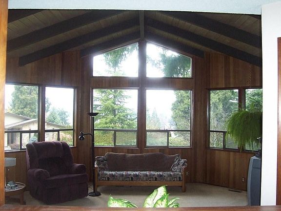 Living room with fireplace and views of the hills