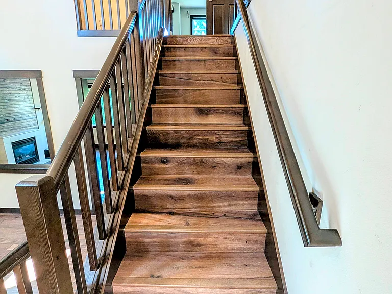 Stairs to 2nd floor. French doors opening into Master BR ahead.