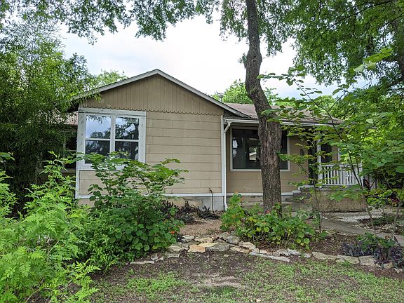 Front yard is xeriscaped with low maintenance plants. Mature trees. Shaded. Private