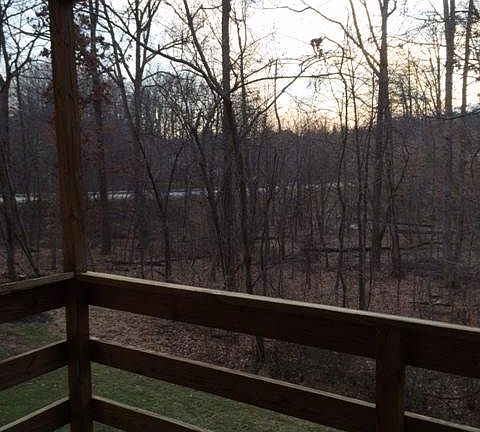Balcony with view of woods