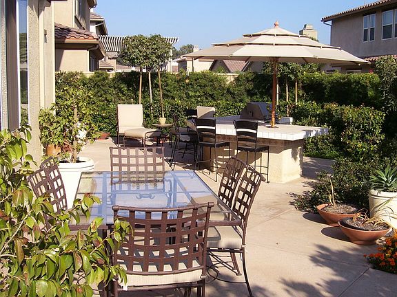 Lush Backyard with Built-in BBQ and Bar