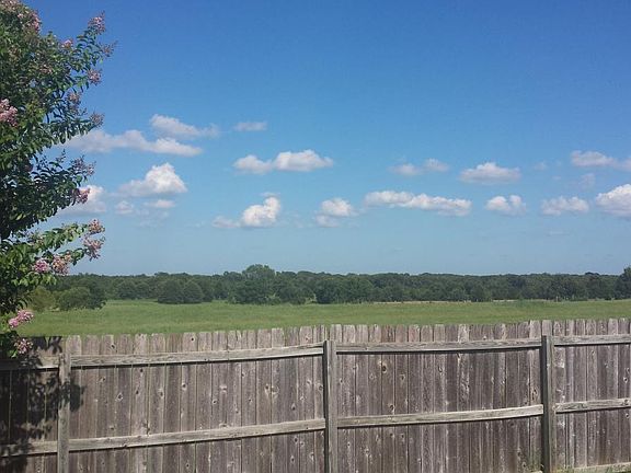 View behind house over fence