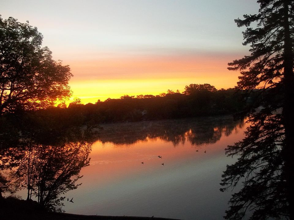 Morning sunrise seen through lake facing windows and/or private patio.