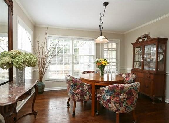 Bright dining room with lots of windows.