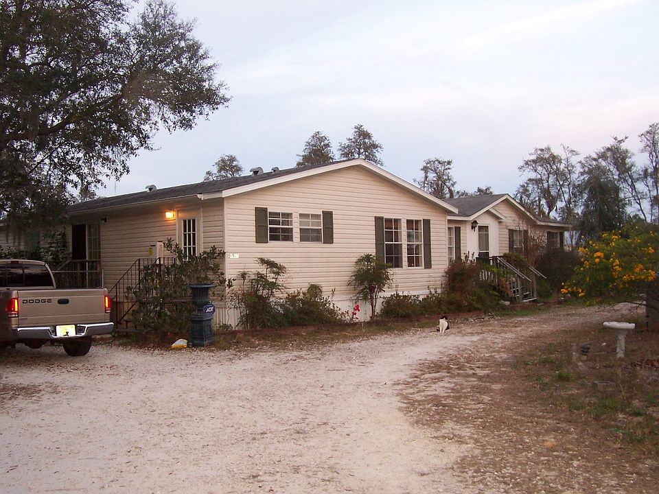 Front of home, W side