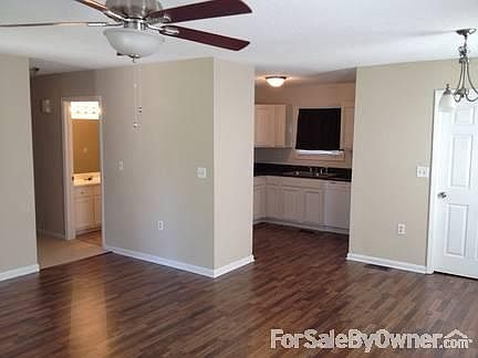 Den/Kitchen
						:
						Large den area featuring new flooring opens into cozy, remodeled kitchen area
