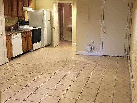 View from entry hall of living area and kitchen