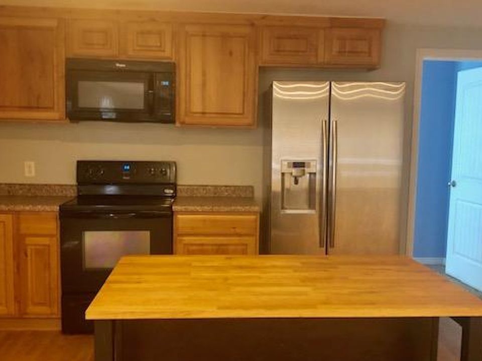 Kitchen with island/fridge