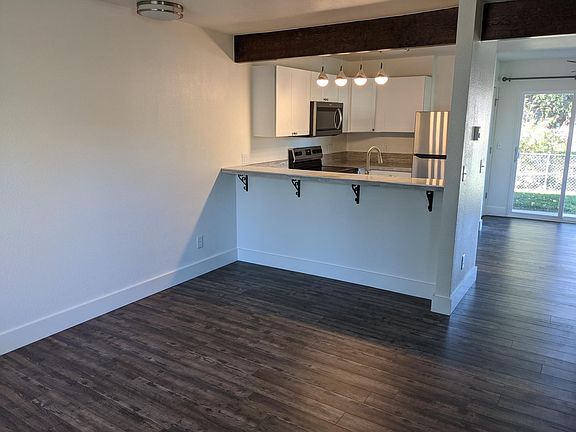 From front entrance: Living room, breakfast bar, kitchen