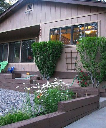 The front of the house has very large windows.