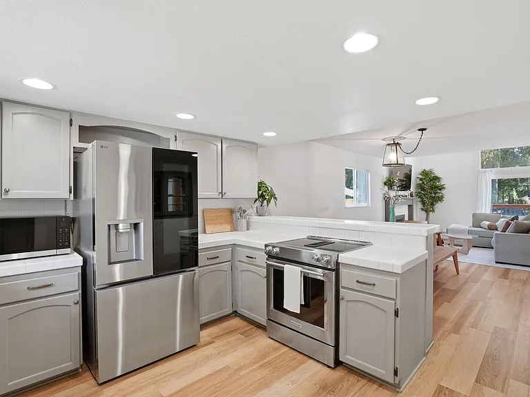 Kitchen opens to dining, living room space. Great all inclusive space for all!
