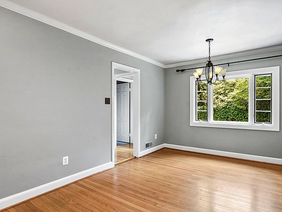 Dining area with large window for nature watching.