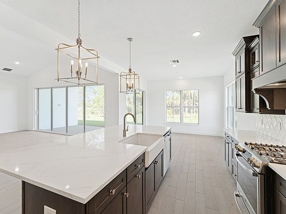 Kitchen with white apron-front sink