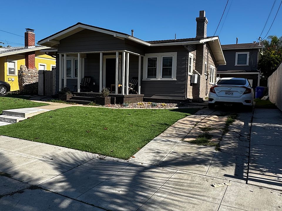 This is the view from the street showing the main house and at the end of the driveway, you can see the back units.
