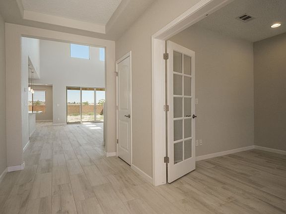 Home features a den in the first floor with french doors.