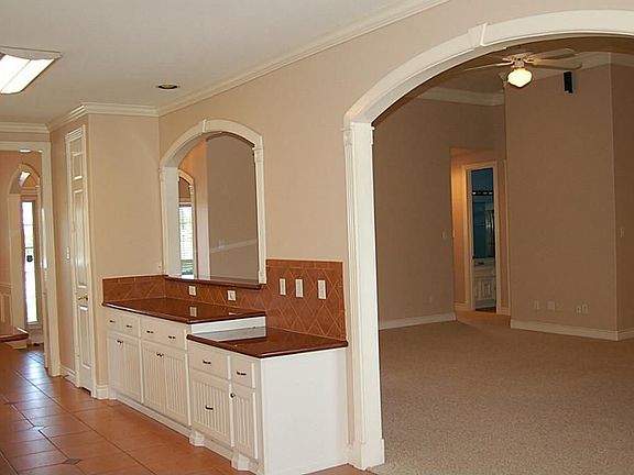 The large kitchen may well be the Hub of this home with views to the side, back patio and pool as well as the family room and breakfast area.